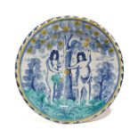 A LONDON DELFTWARE POTTERY ADAM AND EVE CHARGER ATTRIBUTED TO NORFOLK HOUSE, C.1720-30 painted in