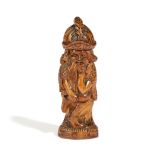 A SWISS TREEN FIGURAL VESTA HOLDER 19TH CENTURY in the form of a bearded gnome smoking a pipe,