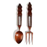 A TREEN YEW LOVE SPOON AND FORK WELSH, FIRST HALF 19TH CENTURY with chip carved decoration and