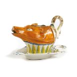 A STAFFORDSHIRE PEARLWARE POTTERY FOX AND GOOSE SAUCEBOAT AND STAND C.1800 the spout in the form