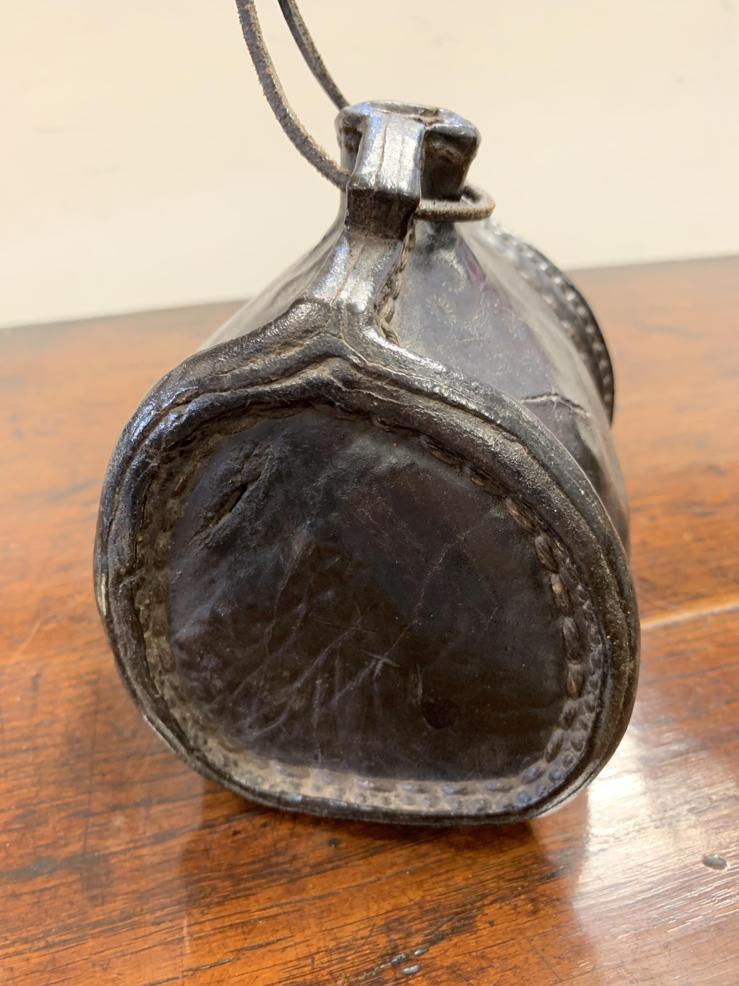 A LEATHER COSTREL LATE 17TH / EARLY 18TH CENTURY of shouldered form, with an open spout, pierced - Image 2 of 7