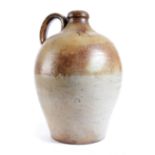 A LARGE BROWN STONEWARE BOTTLE OR FLAGON EARLY 18TH CENTURY with a moulded neck and with a loop