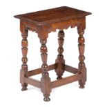 A CHARLES I OAK JOINT STOOL C.1630 the seat with a moulded edge, above a moulded frieze with a