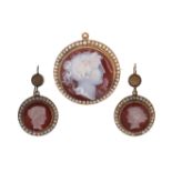 A mid 19th century hardstone cameo and seed pearl -set brooch pendant and pair of earrings, each