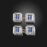 A pair of carved rock crystal and sapphire dress cufflinks, the square octagonal crystals are