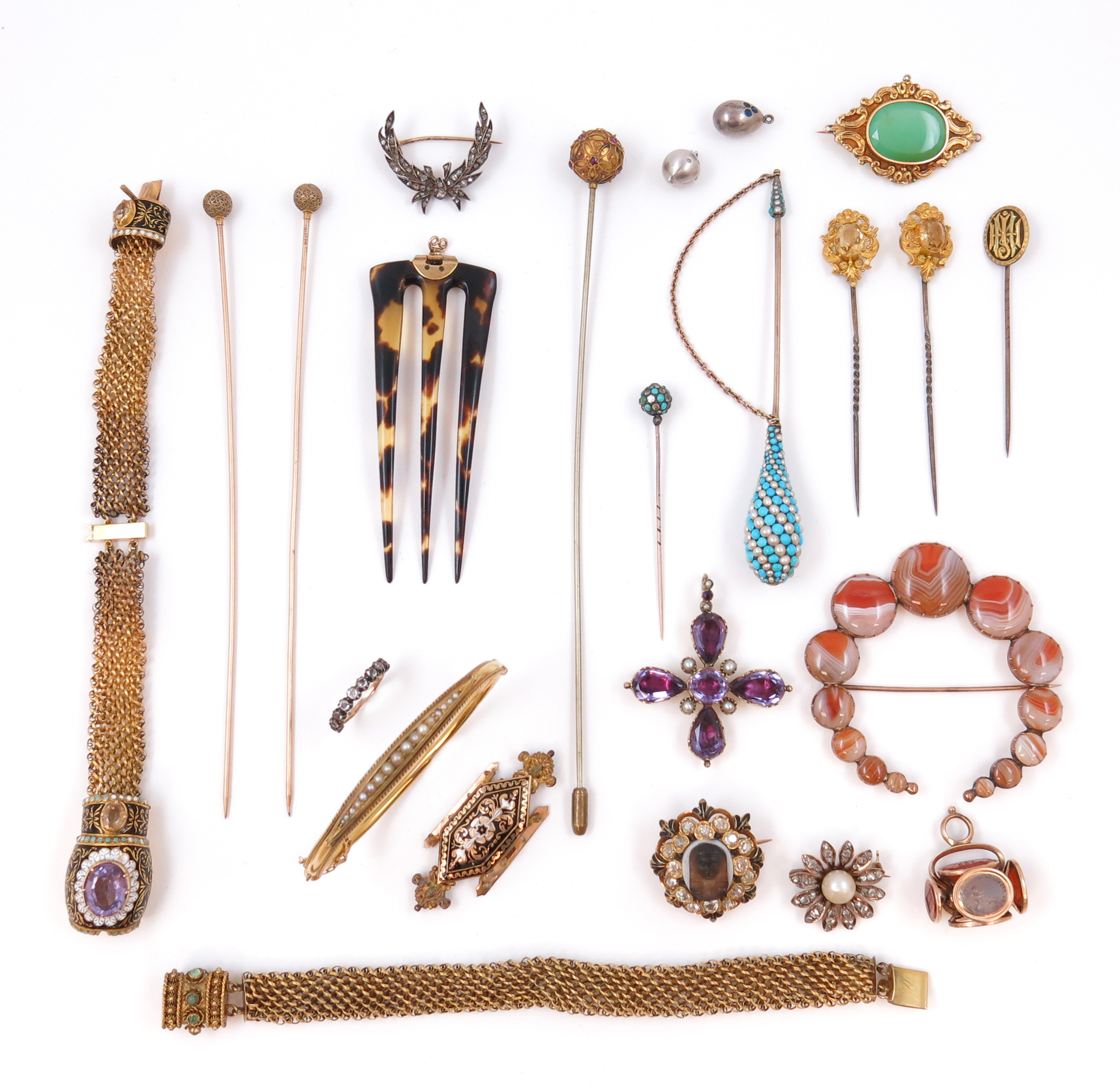 A small collection of mostly 19th century jewellery, including a 15ct gold hinged bangle, the top