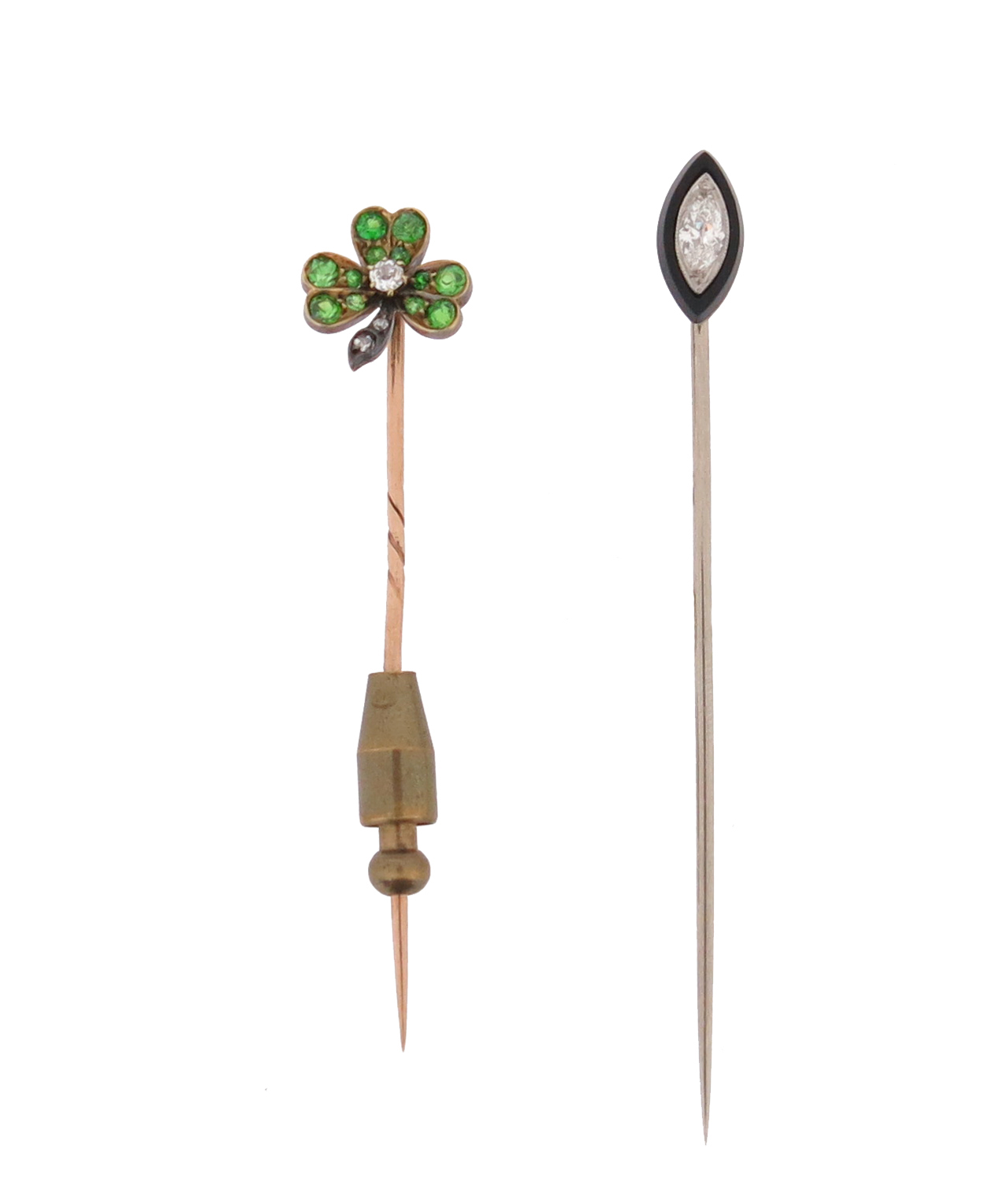 Two gem-set stick pins, including a stick pin set with a trefoil of demantoid garnets and centred