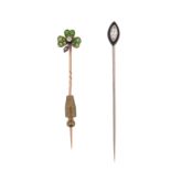 Two gem-set stick pins, including a stick pin set with a trefoil of demantoid garnets and centred