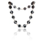 A mid-late 19th century banded agate bead necklace, the eighteen beads measure 20mm diameter,