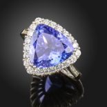 A tanzanite and diamond cluster ring, the triangular-shaped tanzanite set within a surround of round