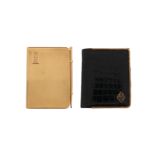 A gold-mounted black leather notebook with 9ct gold pencil by Cartier, signed, and a gold mounted