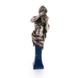 A silver and lapis lazuli desk seal, modelled as Pan playing the pipes, the lapis lazuli pedestal