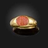 A Roman carnelian intaglio-mounted gold ring, the oval intaglio depicting two warriors in