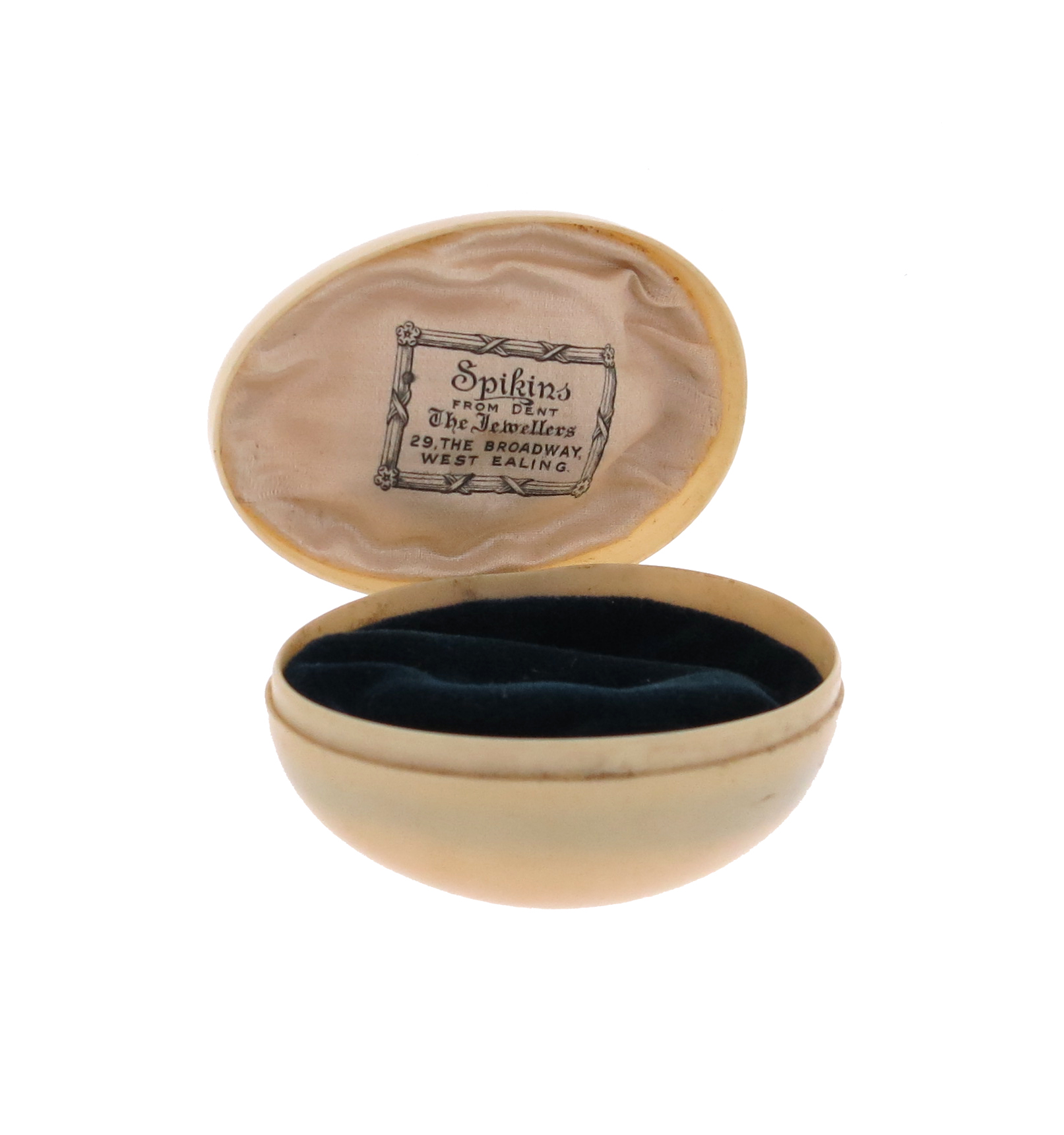 An unusual egg-shaped ivorine hinged case, the interior silk inscribed 'Spinkins from Dent', 6 x 4c