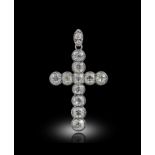 A late 19th century diamond cruciform pendant, set with eleven old cushion-shaped diamonds in silver