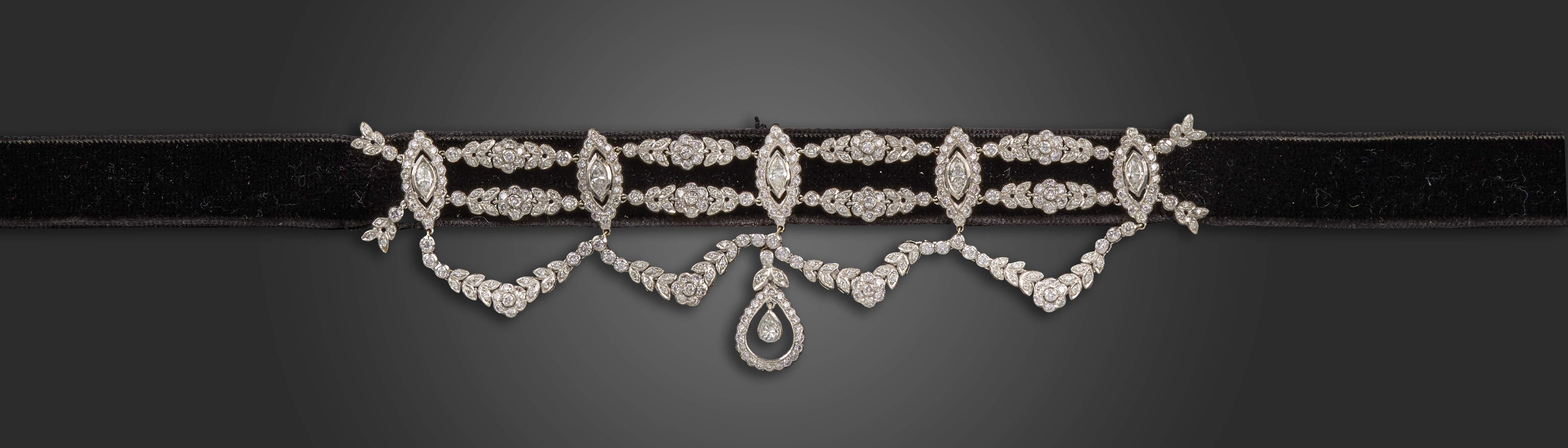 A Belle Epoque-style diamond-set choker necklace, the black velvet band is mounted with five