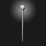 A French cultured pearl stickpin, the platinum shaft with diamond-set rondel, French control mark,