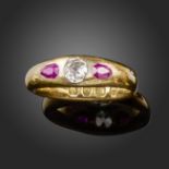 A late 19th century ruby and diamond gold gypsy ring, set with an old cushion-shaped diamond and two