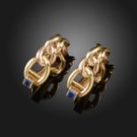 A pair of gold stylised curb-link A-form cufflinks by Cartier, the bars set with a square-shaped