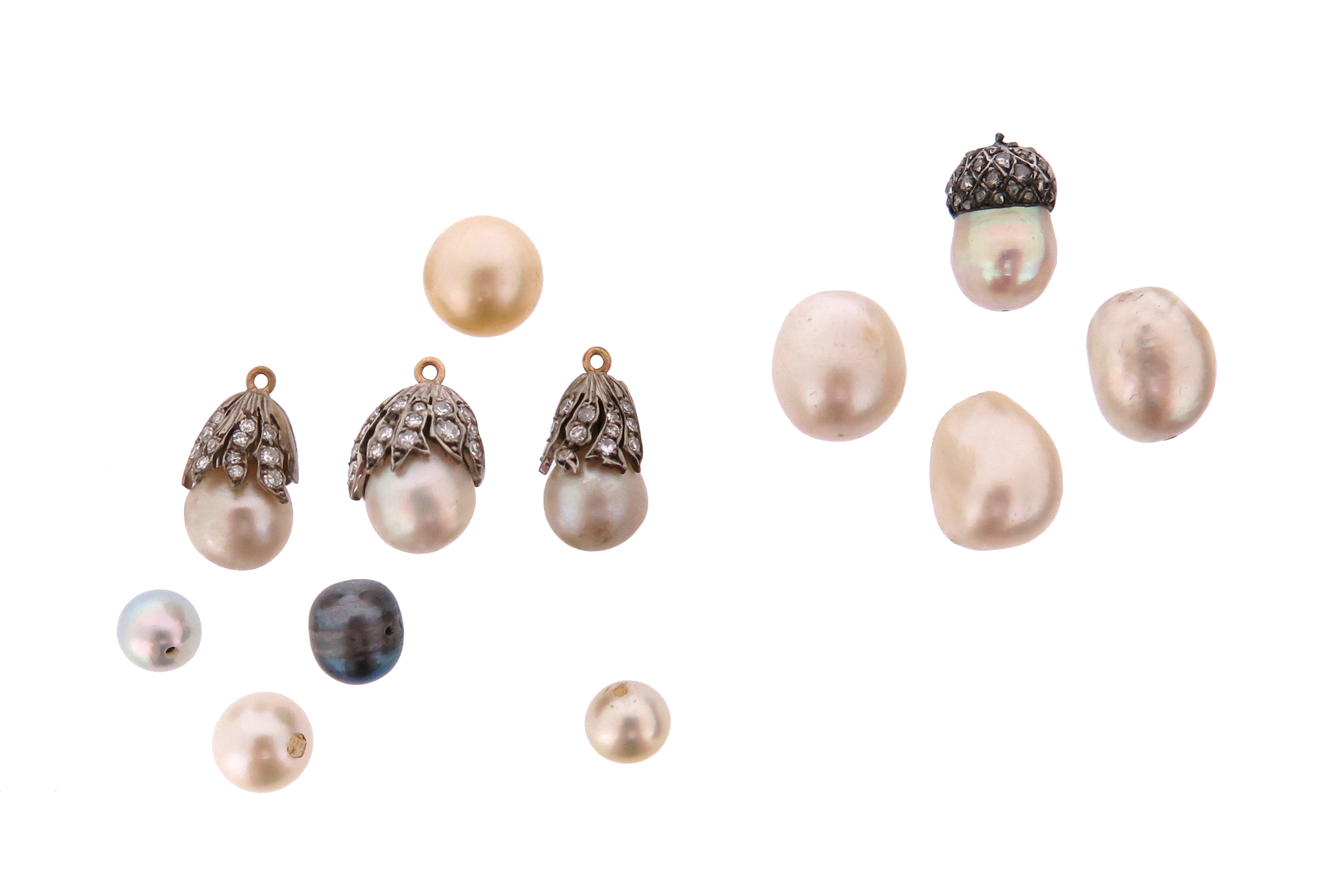 Twelve natural and cultured pearl items, including three loose natural pearls and a natural pearl-