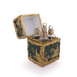 An 18th century enamel bottle holder with hinged cover, of rectangular form with green and gold