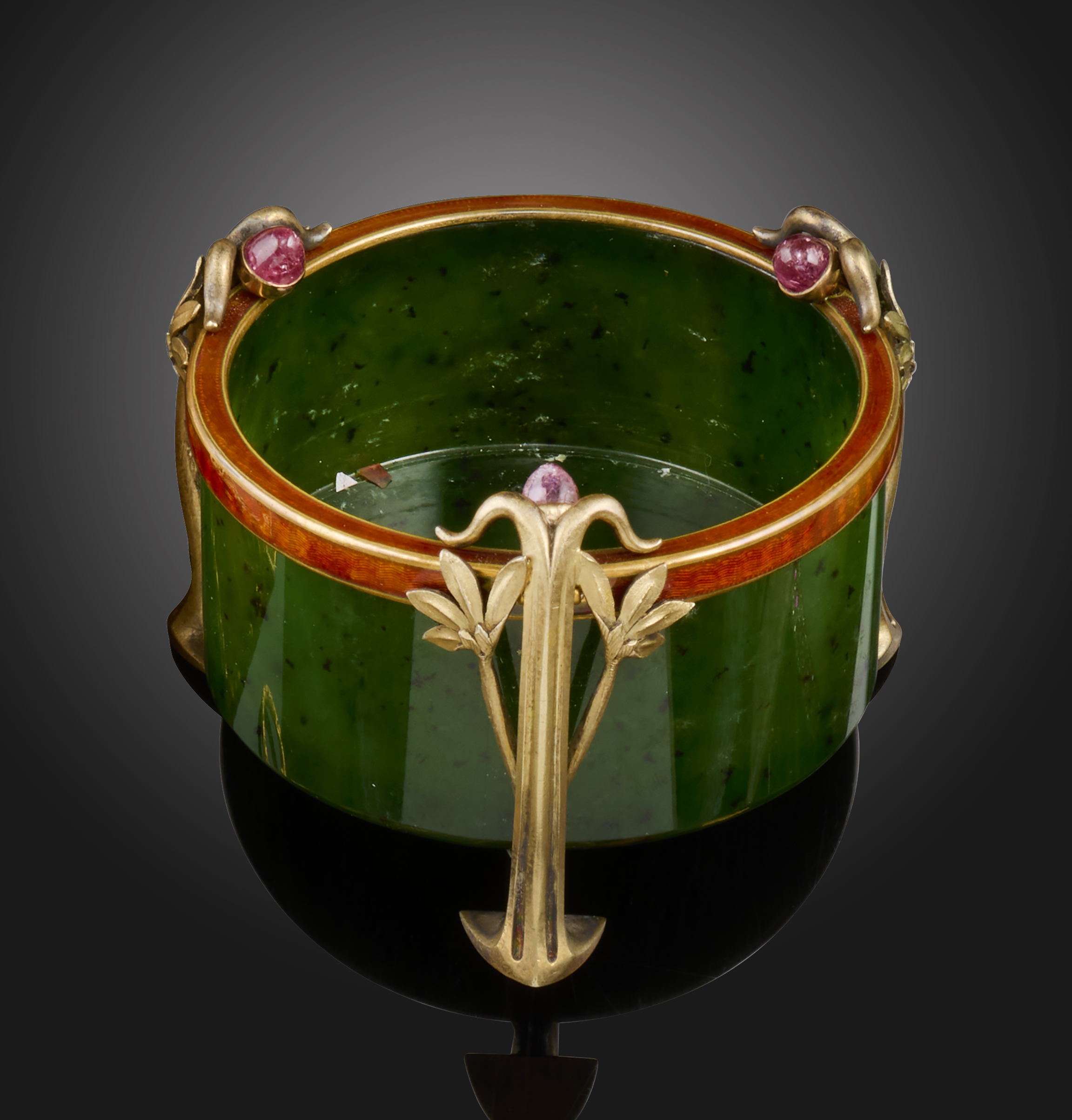 A Russian Art Nouveau circular nephrite pot, on three silver gilt foliate feet, each mounted with