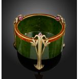 A Russian Art Nouveau circular nephrite pot, on three silver gilt foliate feet, each mounted with