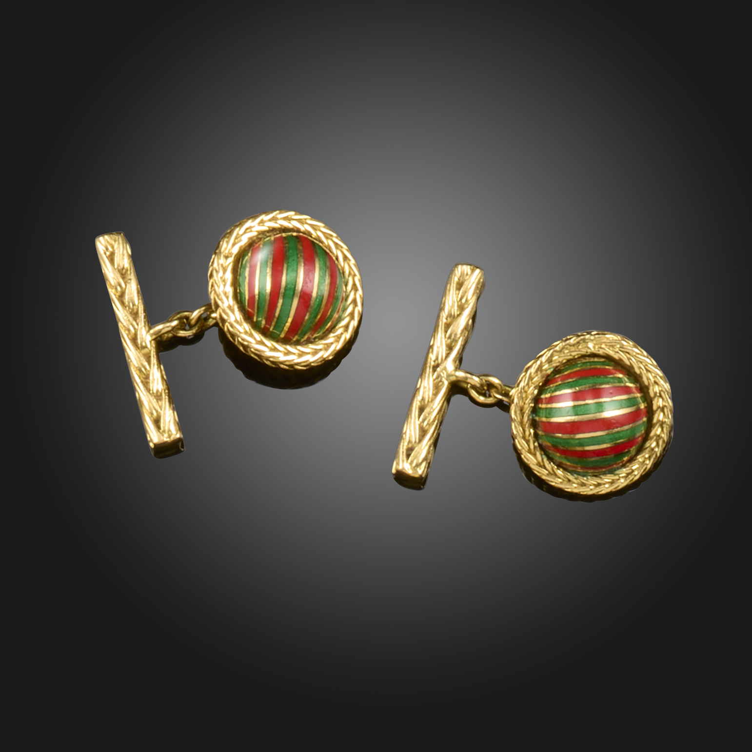 A pair of green and red enamel striped semi-spherical gold cufflinks by Boucheron, in chevron-