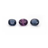 Three unset spinels, one oval-shaped purple spinel 5.60cts, an oval-shaped blue spinel 6.12cts,