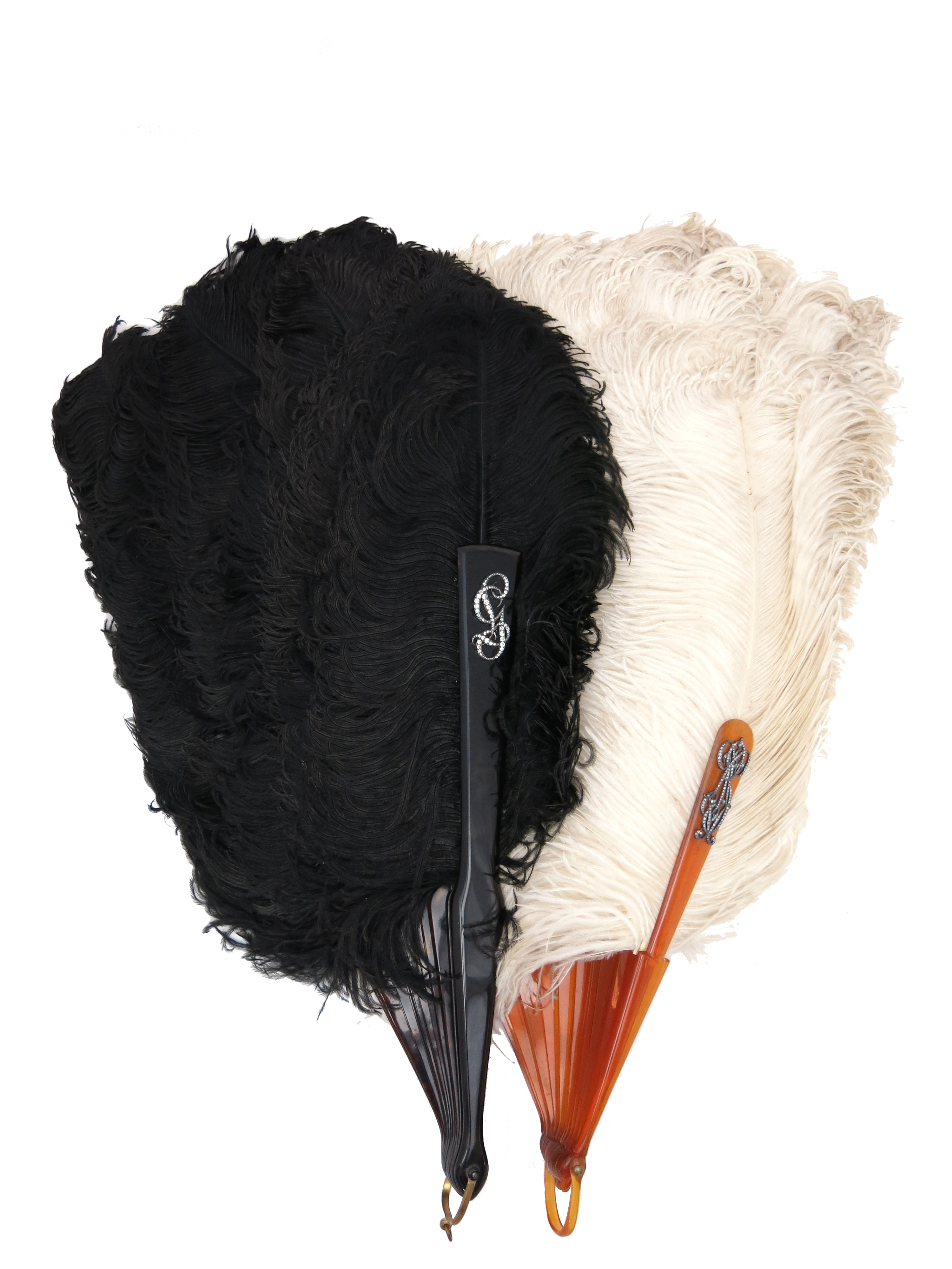 Two early 20th century ostrich plume fans, one with white feathers, the other with black feathers,