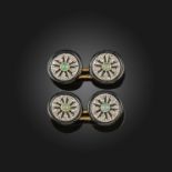 A pair of French early 20th century gem-set cufflinks, each circular link centred with a green stone