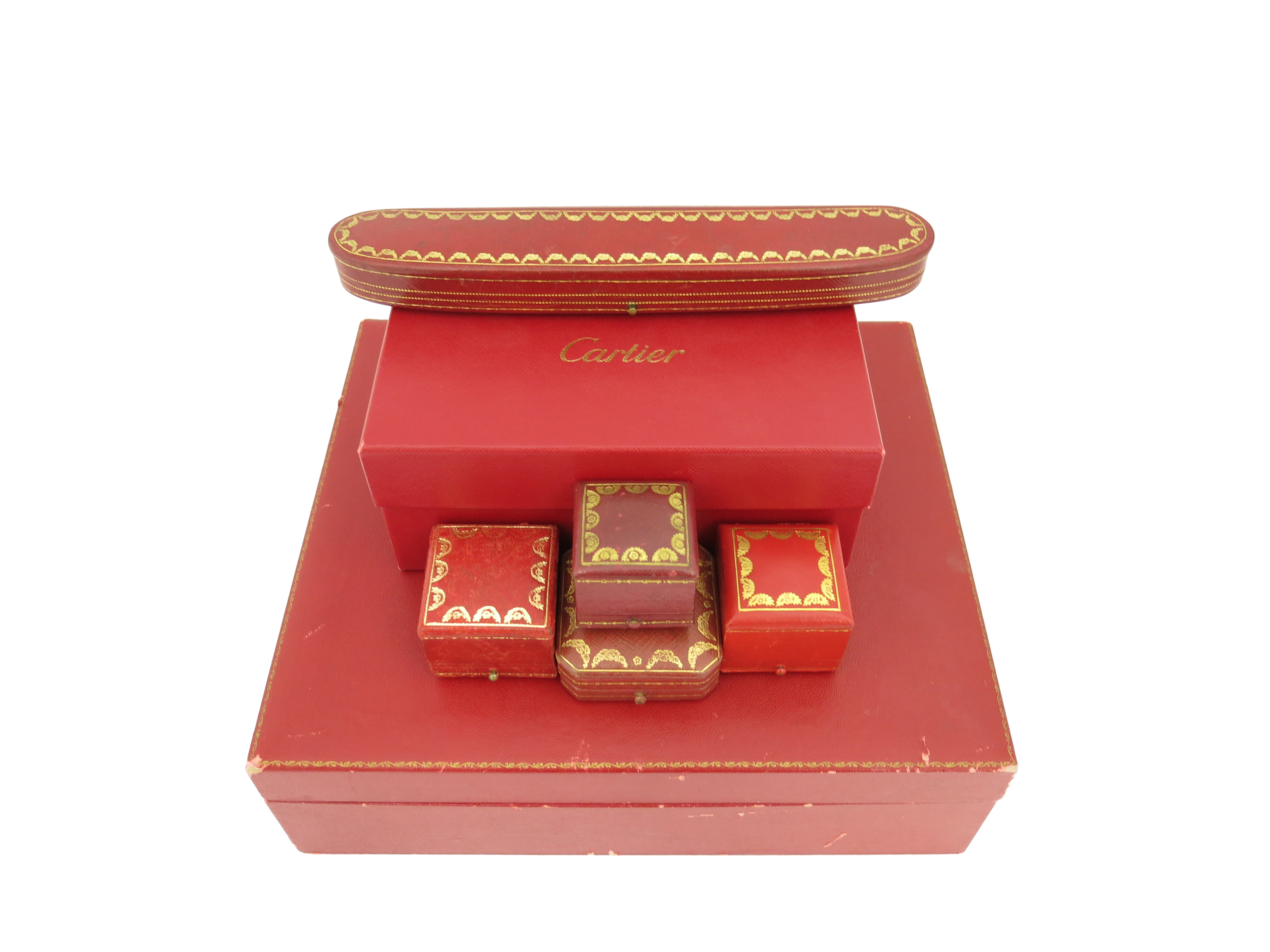 Six jewellery boxes by Cartier, including a slightly curved bracelet case