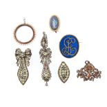 An 18th century foliate pendant set with topaz in a silver closed-back mount, 4cm wide; an 18th