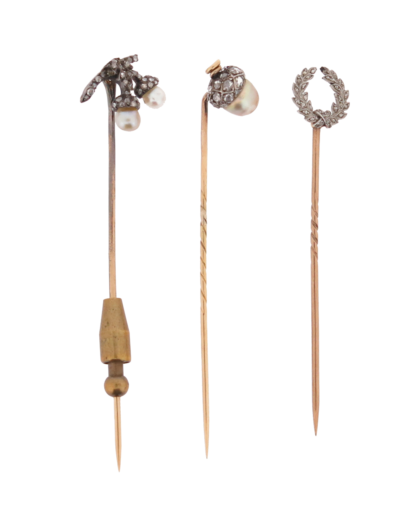 Three late 19th century - early 20th century diamond-set stick pins, including a stick pin