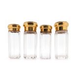 Two pairs of Edwardian 18ct gold-lidded glass toilette bottles for Asprey London, each with a