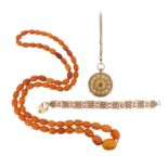 A graduated amber bead necklace, the oval beads graduate from 1.0 - 2.4cm long, necklace 95cm