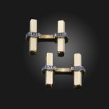 A pair of sapphire-set white gold by Cartier, the square-form bars with striated decoration and