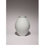 A TALL KOREAN WHITE GLAZE MOON JAR MODERN, 20TH CENTURY The elegant vessel made of two halves joined