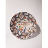 A MASSIVE SAMSON IMARI DISH 19TH CENTURY The well decorated with a large shaped panel enclosing a