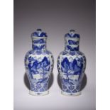 A PAIR OF CHINESE BLUE AND WHITE VASES AND COVERS KANGXI 1662-1722 Decorated with alternate panels