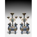 A LARGE PAIR OF CHINESE CLOISONNE ENAMELLED 'DOUBLE-RAMS' CANDLESTICKS QING DYNASTY OR LATER Each