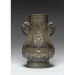 A LARGE CHINESE SILVER AND GOLD INLAID BRONZE ARCHAISTIC HU-SHAPED VASE QING DYNASTY The pear-shaped