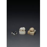 THREE CHINESE JADE SEALS MING AND QING DYNASTIES One in white jade, carved with a mythical beast