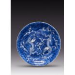 A LARGE CHINESE BLUE AND WHITE 'DRAGON' DISH KANGXI 1662-1722 With a gently flared rim, painted with