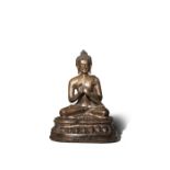 A CHINESE BRONZE FIGURE OF BUDDHA DIPANKARA 15TH CENTURY The figure seated in dhyanasana on a