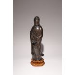 A CHINESE SILVER-INLAID BRONZE FIGURE OF GUANYIN QING DYNASTY Cast standing and wearing long robes