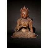 A LARGE CHINESE LACQUERED WOOD FIGURE OF GUANYIN MING DYNASTY Seated in dhyanasana, with the right