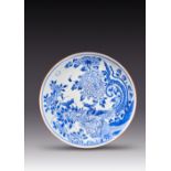 A LARGE CHINESE BLUE AND WHITE 'PHOENIX' DISH TRANSITIONAL C.1660 Boldly painted with two phoenix