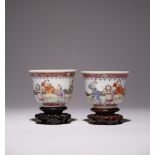 A PAIR OF CHINESE FAMILLE ROSE 'BOYS' CUPS REPUBLIC PERIOD Each with a flared U-shaped body,