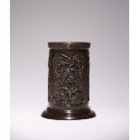 A CHINESE BRONZE BRUSHPOT, BITONG 17TH CENTURY Cast in relief with three panels containing leafy